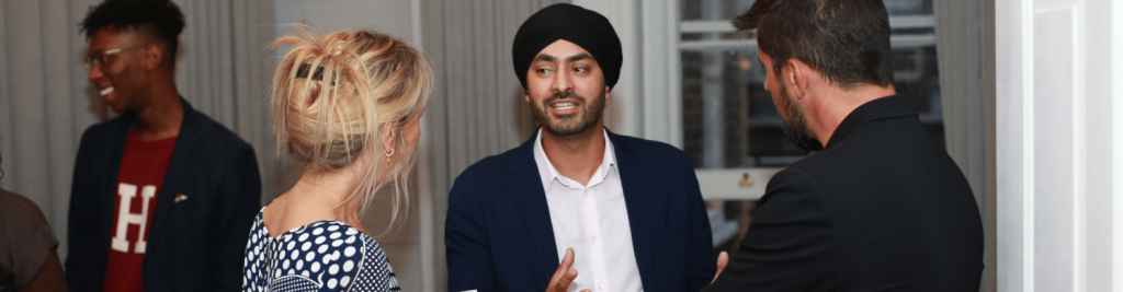 Diverse group of people are talking and having a good time, during a networking event