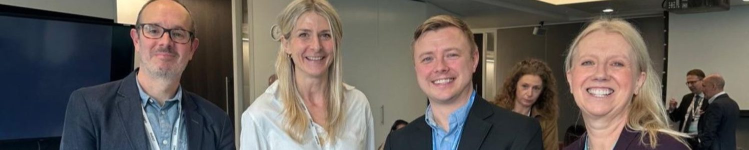 Photo of Johanna Beresford among other senior leaders