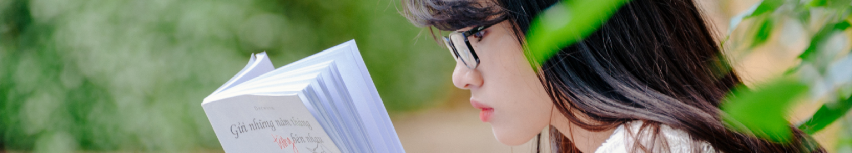 Asian woman reading a book