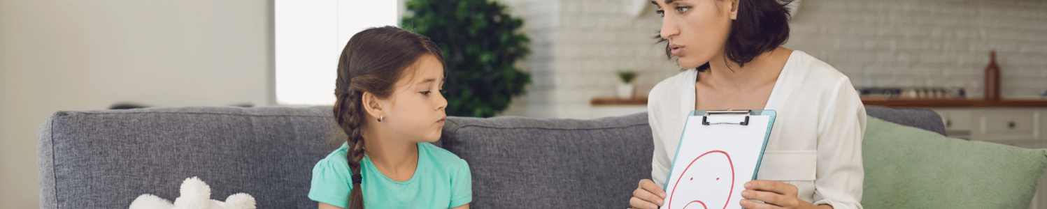 Mother explaining something to her daughter