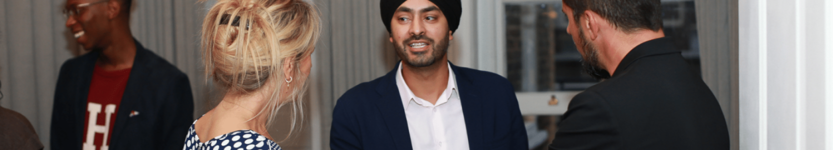 Diverse group of people are talking and having a good time, during a networking event